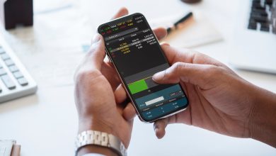 person checking cryptocurrency trading app on mobile