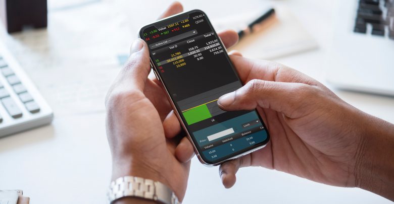 person checking cryptocurrency trading app on mobile